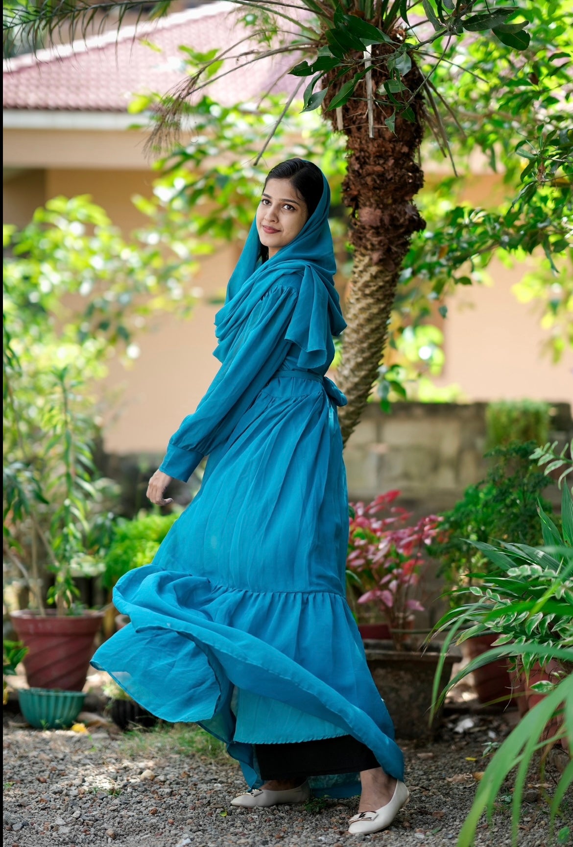 Gown with handworked belt