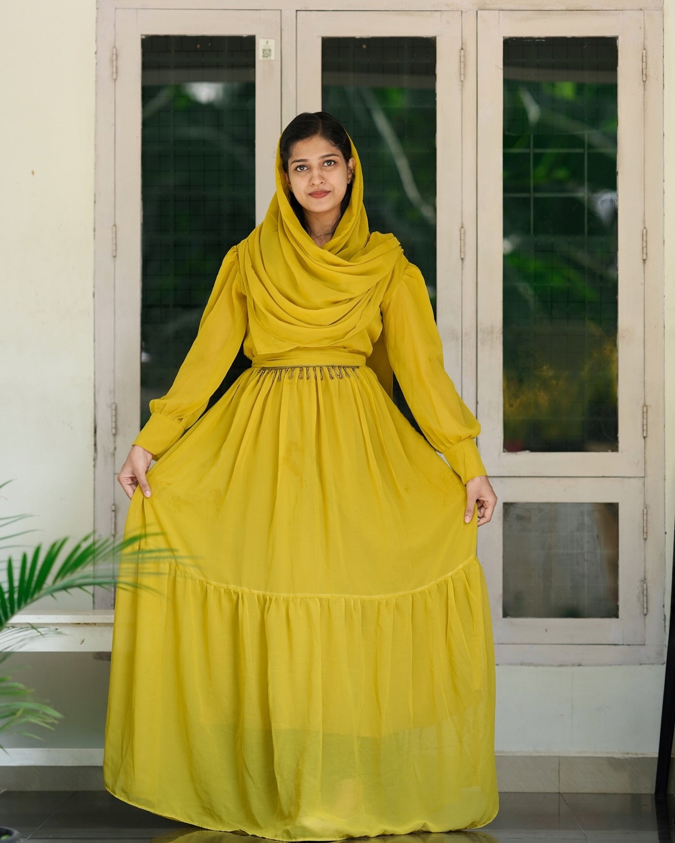 Gown with handworked belt